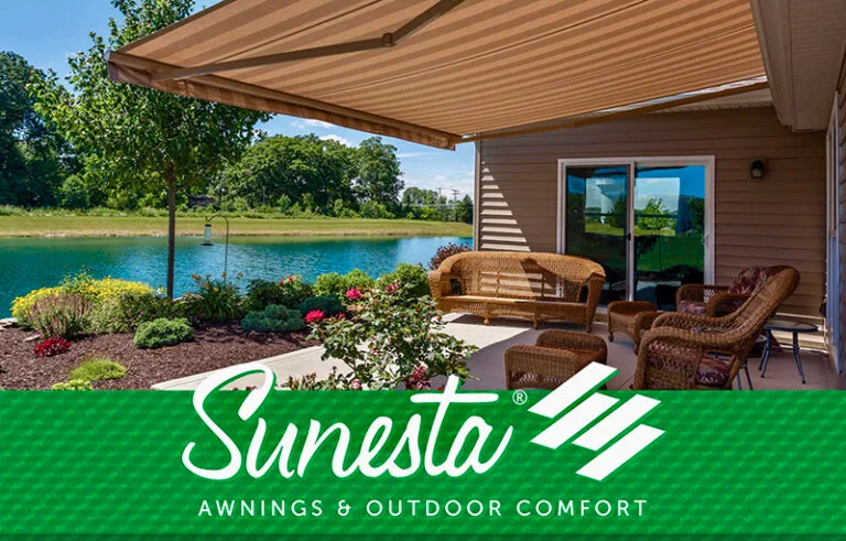 tan Sunesta retractable awning over back patio