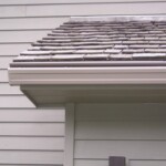 Roof with Seamless Gutters and Gutter Helmets