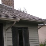 Roof with Seamless Gutters and Gutter Helmets