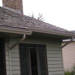 Roof with Seamless Gutters and Gutter Helmets