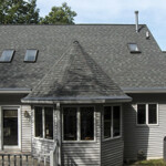 View of a home with rain gutter helmets